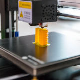 image of a 3d printer printing a plastic part