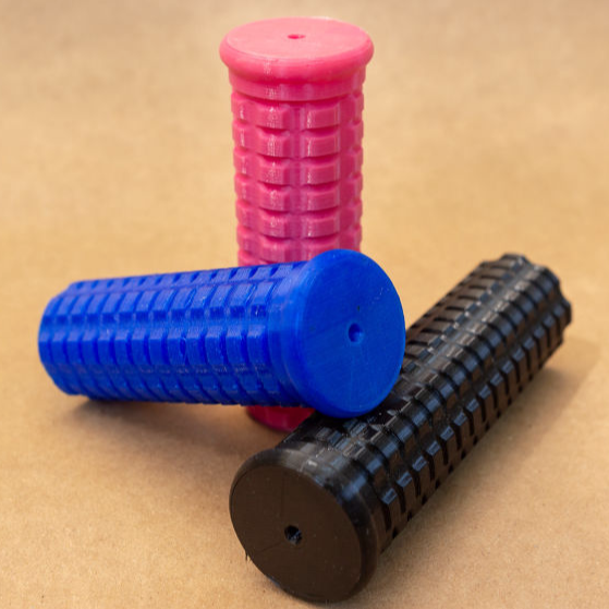 image of 3 wheelchair handle grips in blue, pink and black