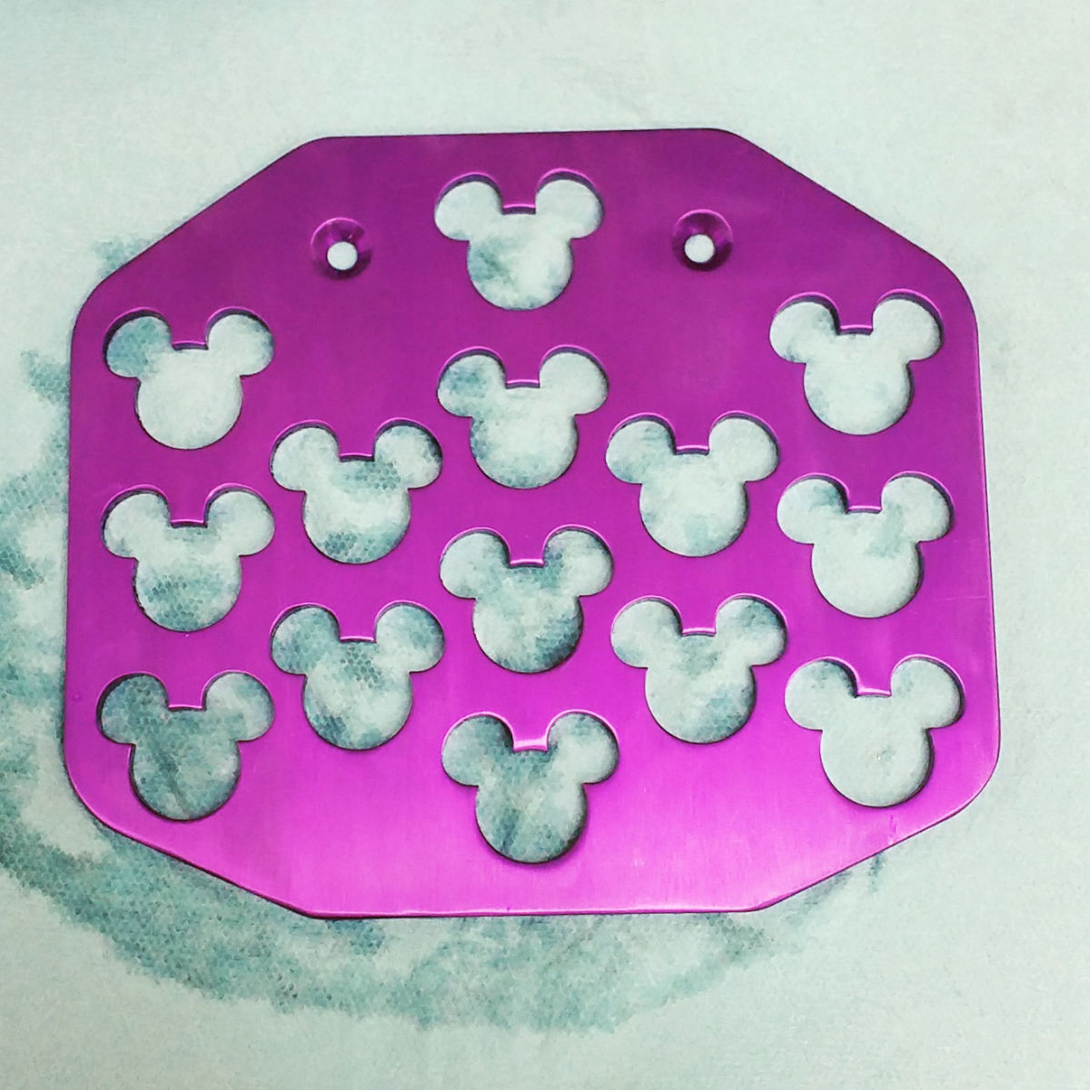 wheelchair footplate with mickey mouse cut into it
